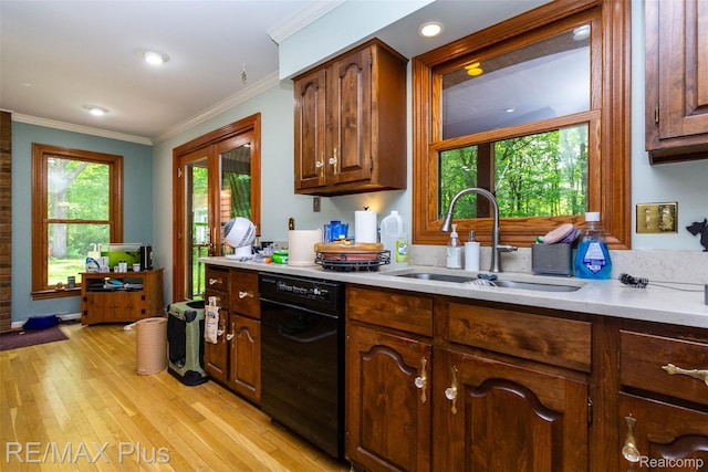 3168 Farmbrook Ln, Metamora, MI 48455 - kitchen with dishwasher, a sink, light countertops, light wood-type flooring, and crown molding