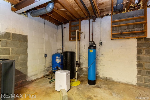 3168 Farmbrook Ln, Metamora, MI 48455 - unfinished below grade area featuring a water pressure tank and a water softener