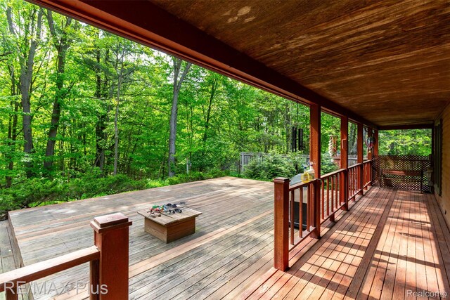 3168 Farmbrook Ln, Metamora, MI 48455 - wooden deck with a wooded view