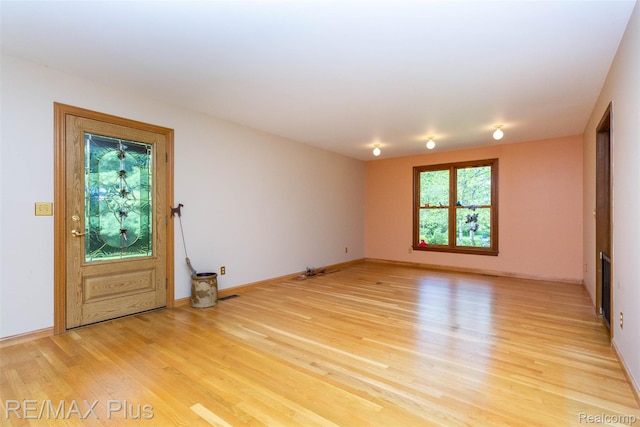 3168 Farmbrook Ln, Metamora, MI 48455 - spare room featuring light wood-style flooring and baseboards