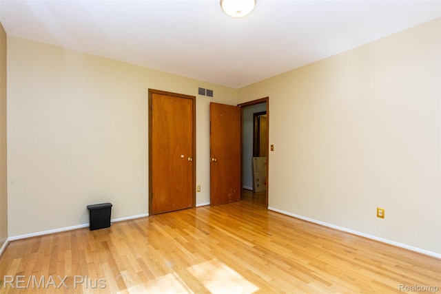 3168 Farmbrook Ln, Metamora, MI 48455 - spare room with light wood-type flooring and baseboards