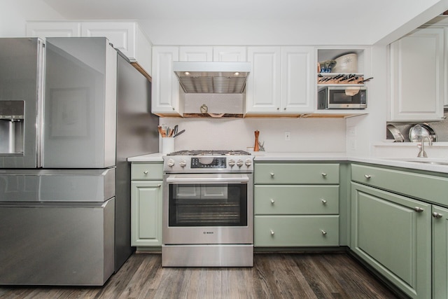 2142 Spring Ridge Dr, Ann Arbor, MI 48103 - kitchen with stainless steel appliances, green cabinetry, a sink, and white cabinetry