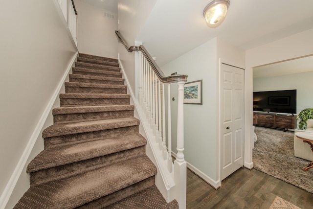 2142 Spring Ridge Dr, Ann Arbor, MI 48103 - staircase with wood finished floors and baseboards