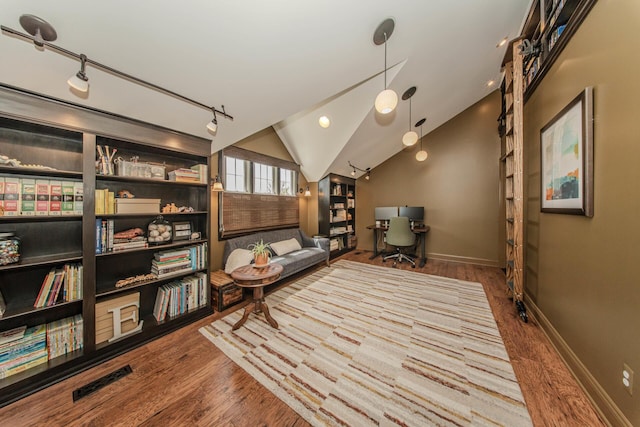 2142 Spring Ridge Dr, Ann Arbor, MI 48103 - living area featuring wood finished floors, lofted ceiling, baseboards, and an office area