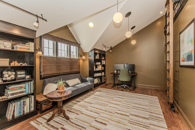 2142 Spring Ridge Dr, Ann Arbor, MI 48103 - sitting room featuring wood finished floors, baseboards, vaulted ceiling, and track lighting