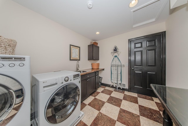 2142 Spring Ridge Dr, Ann Arbor, MI 48103 - laundry area featuring washer and clothes dryer, cabinet space, recessed lighting, and baseboards