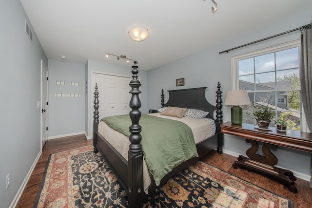 2142 Spring Ridge Dr, Ann Arbor, MI 48103 - bedroom with wood finished floors, baseboards, and a closet
