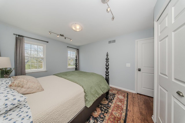 2142 Spring Ridge Dr, Ann Arbor, MI 48103 - bedroom with wood finished floors, track lighting, and baseboards