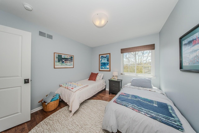 2142 Spring Ridge Dr, Ann Arbor, MI 48103 - bedroom featuring dark wood-type flooring and baseboards