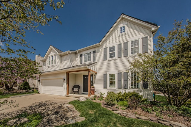 2142 Spring Ridge Dr, Ann Arbor, MI 48103 - traditional-style home with driveway, an attached garage, and a chimney