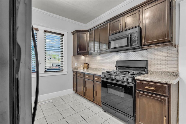 kitchen with black appliances, decorative backsplash, dark brown cabinets, light tile patterned floors, and crown molding