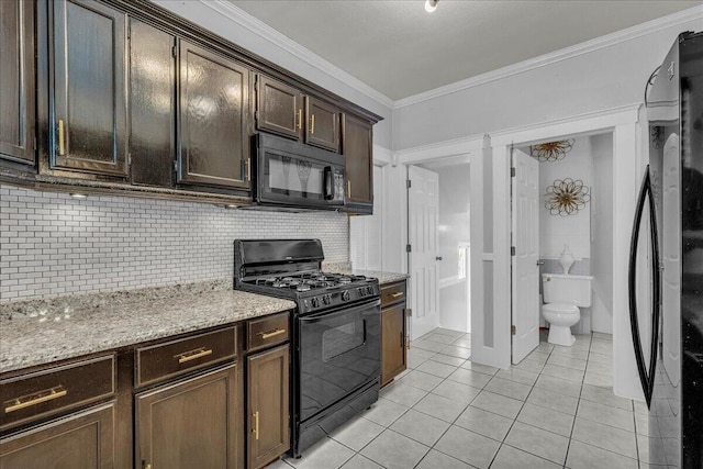 kitchen with black appliances, light tile patterned floors, decorative backsplash, ornamental molding, and dark brown cabinets