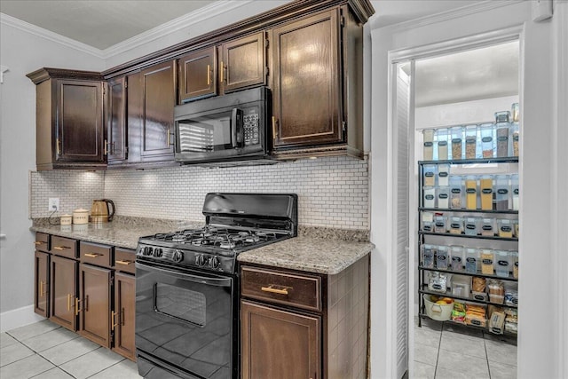 kitchen featuring black appliances, light tile patterned flooring, dark brown cabinets, and crown molding