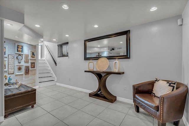 stairs featuring tile patterned flooring, recessed lighting, and baseboards