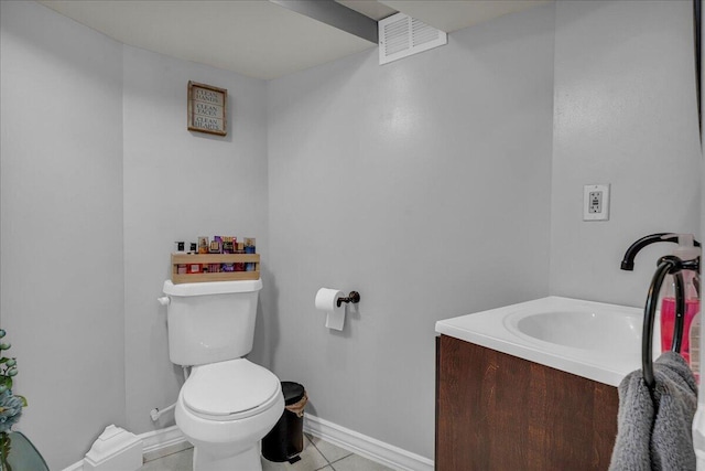 bathroom featuring toilet, baseboards, tile patterned floors, and vanity