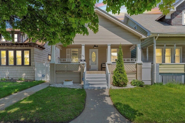 view of front facade with a porch and a front yard
