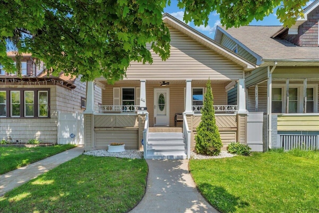 view of front facade with covered porch and a front yard