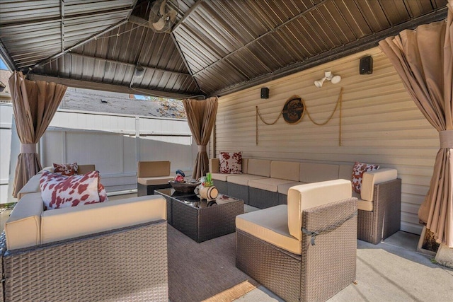 view of patio / terrace featuring a gazebo, outdoor lounge area, and fence
