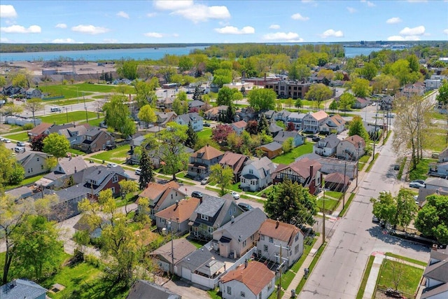 aerial view of residential area with a large body of water