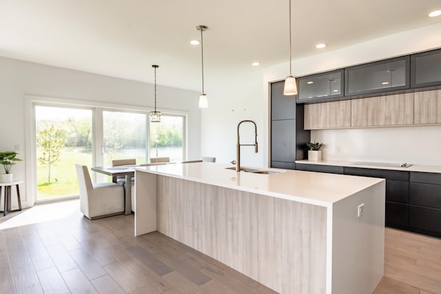 54598 Deadwood Ln, Utica, MI 48316 - kitchen with modern cabinets, a sink, light countertops, light brown cabinets, and recessed lighting