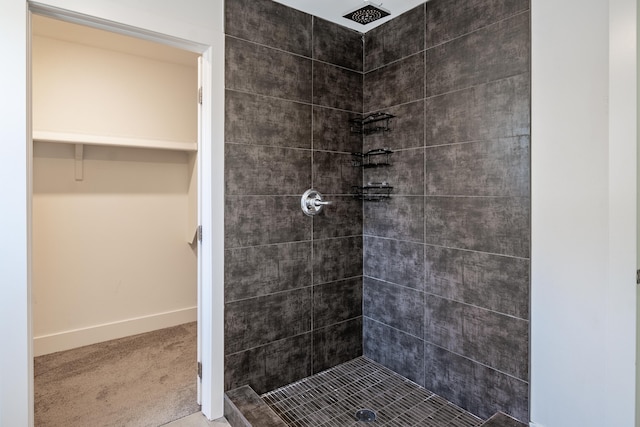 54598 Deadwood Ln, Utica, MI 48316 - bathroom featuring a stall shower, baseboards, and a spacious closet