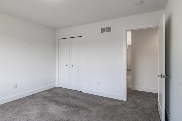 54598 Deadwood Ln, Utica, MI 48316 - unfurnished bedroom featuring dark carpet, baseboards, and a closet