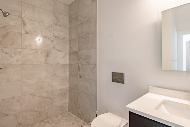 54598 Deadwood Ln, Utica, MI 48316 - bathroom featuring vanity, toilet, and tiled shower