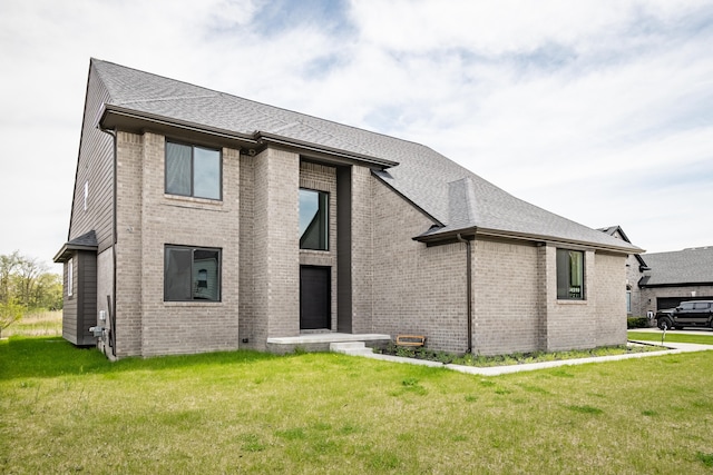 54598 Deadwood Ln, Utica, MI 48316 - view of front of property with a front lawn, brick siding, and roof with shingles
