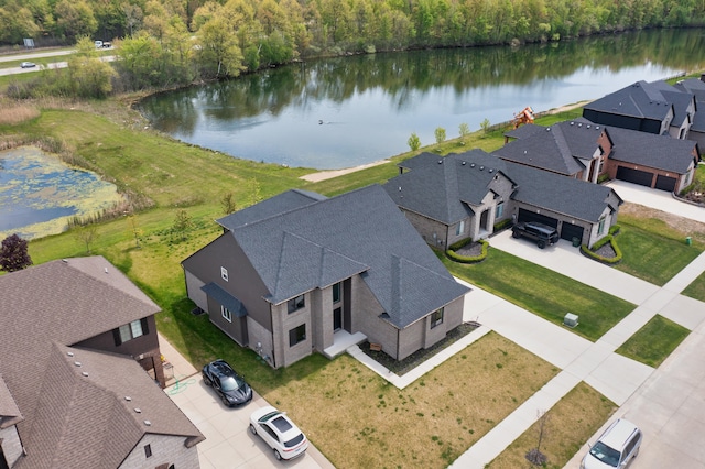 54598 Deadwood Ln, Utica, MI 48316 - aerial view of residential area featuring a large body of water and a heavily wooded area