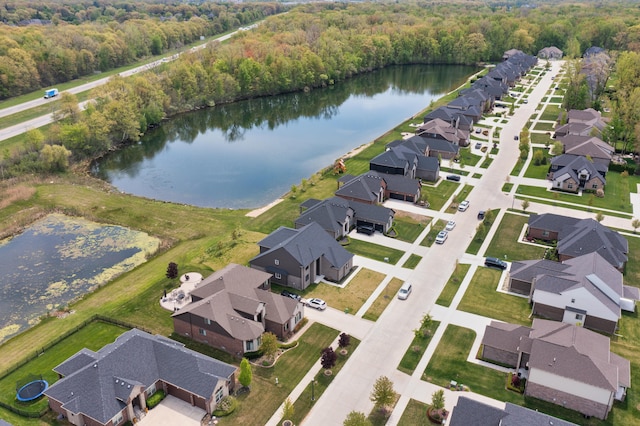 54598 Deadwood Ln, Utica, MI 48316 - aerial view of property and surrounding area featuring a heavily wooded area, nearby suburban area, and a nearby body of water