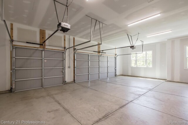 9058 Fielding Dr, Brighton, MI 48116 - garage featuring a garage door opener