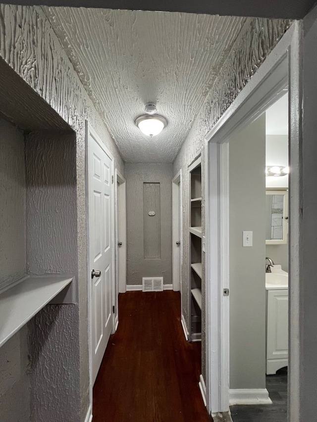 14903 Woodmont Ave, Detroit, MI 48227 - hall featuring wood finished floors, a sink, and baseboards