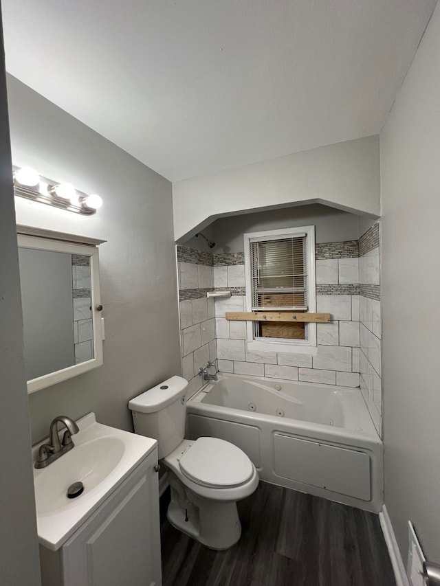 14903 Woodmont Ave, Detroit, MI 48227 - bathroom with wood finished floors, a combined bath / shower with jetted tub, toilet, and vanity
