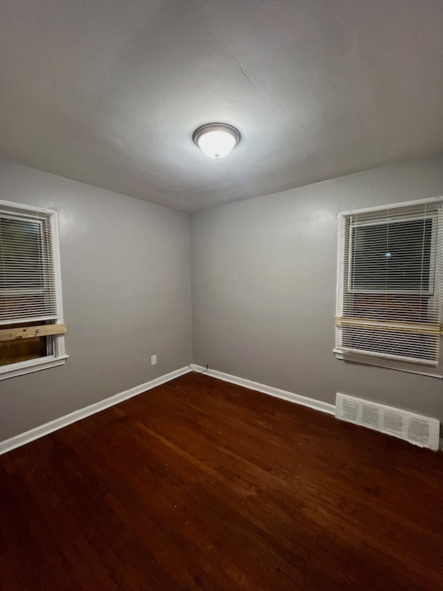 14903 Woodmont Ave, Detroit, MI 48227 - spare room featuring wood finished floors and baseboards