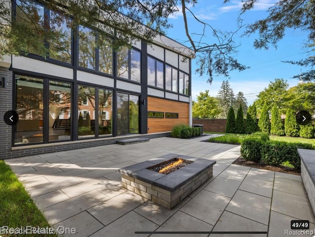 145 Westchester Way, Birmingham, MI 48009 - rear view of house with an outdoor fire pit and a patio area