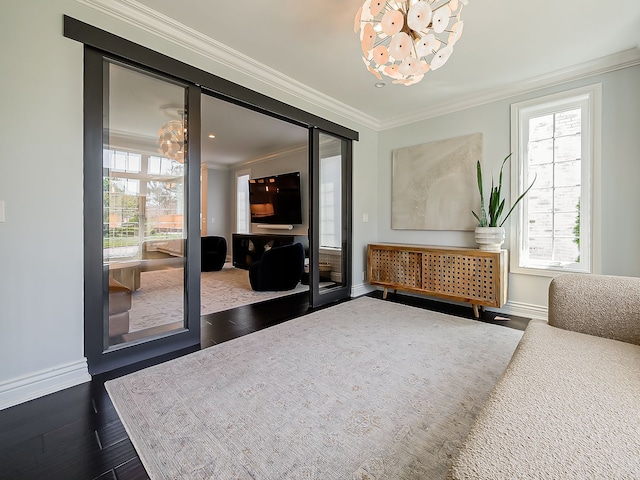 interior space featuring a chandelier, crown molding, baseboards, and dark wood-style floors