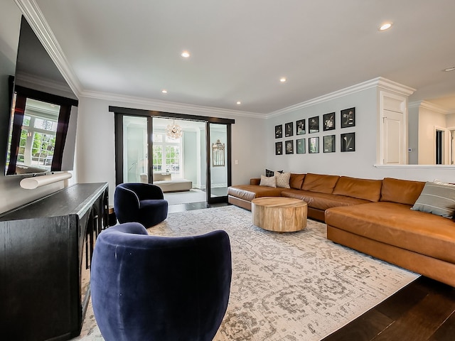 living area with crown molding, recessed lighting, and wood finished floors
