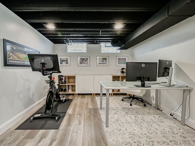 office space with wood finished floors and baseboards