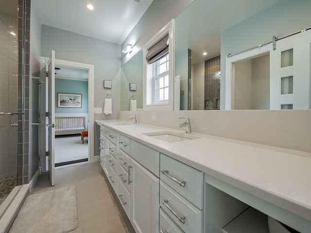 full bathroom with a stall shower, double vanity, tile patterned floors, and recessed lighting