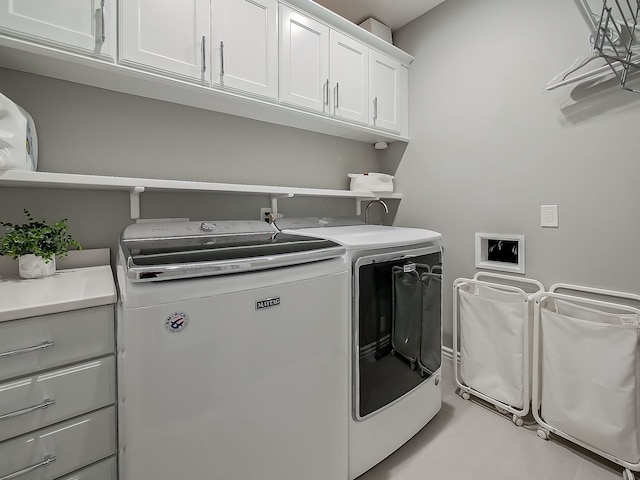 laundry area featuring washer and dryer and cabinet space