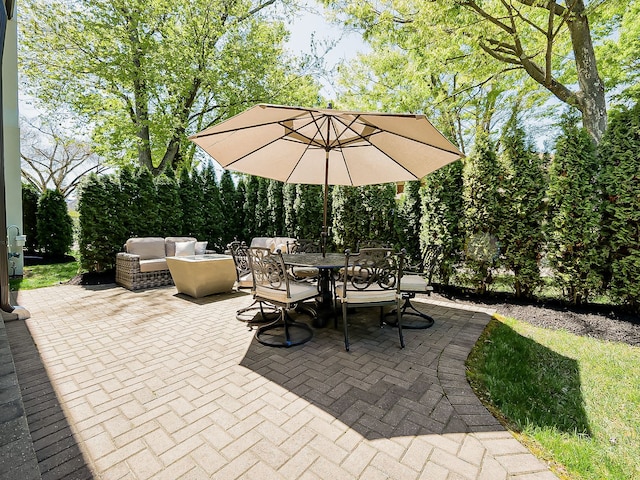 view of patio / terrace with outdoor dining space and an outdoor hangout area