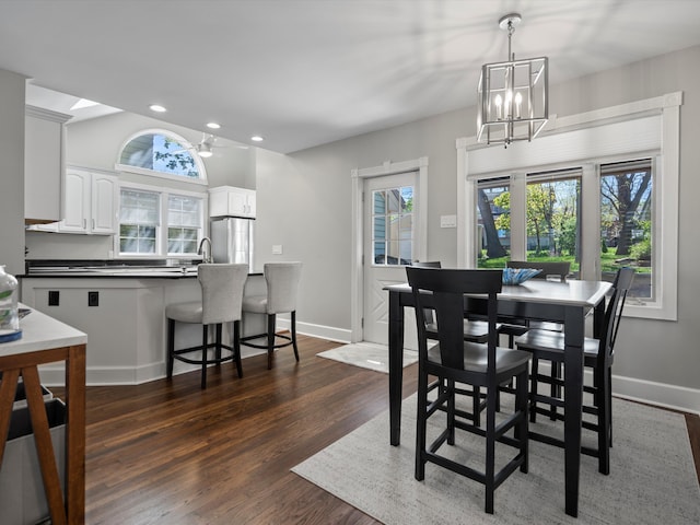 270 S Center St, Northville, MI 48167 - dining area with plenty of natural light, a chandelier, dark wood-style flooring, recessed lighting, and baseboards