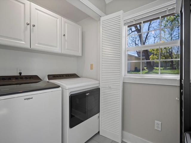 270 S Center St, Northville, MI 48167 - laundry area with cabinet space, separate washer and dryer, light tile patterned floors, and baseboards