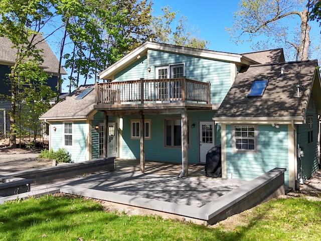 270 S Center St, Northville, MI 48167 - rear view of house featuring a deck and roof with shingles