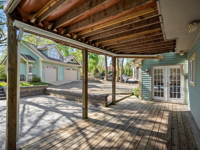 270 S Center St, Northville, MI 48167 - deck featuring a garage and french doors