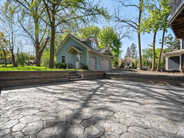 270 S Center St, Northville, MI 48167 - view of community featuring an attached garage and driveway