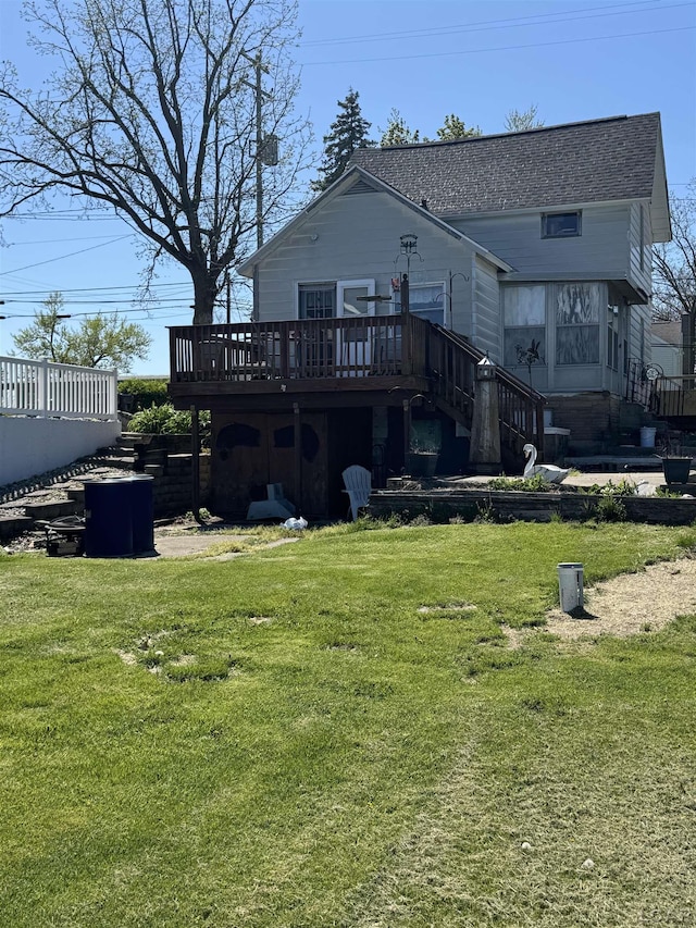 1730 Round Lake Hwy, Manitou Beach, MI 49253 - rear view of house featuring a deck, a yard, and a shingled roof