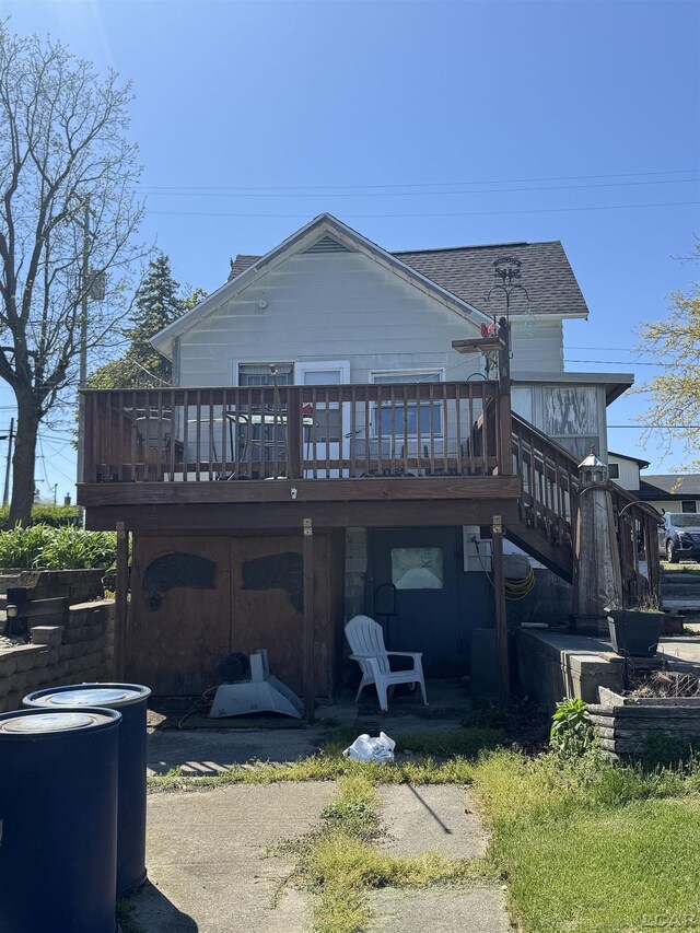 1730 Round Lake Hwy, Manitou Beach, MI 49253 - back of property featuring a wooden deck and a shingled roof