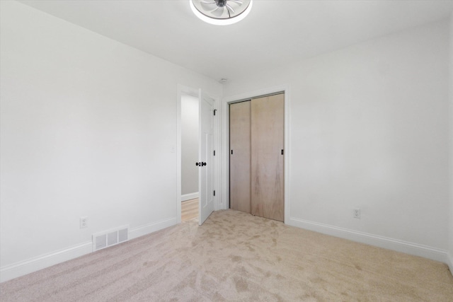 1431 E Oliver St, Owosso, MI 48867 - empty room featuring carpet flooring and baseboards