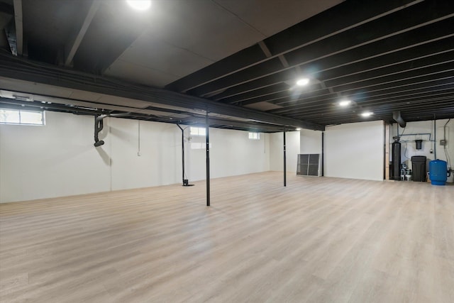 1431 E Oliver St, Owosso, MI 48867 - basement featuring a water pressure tank and wood finished floors